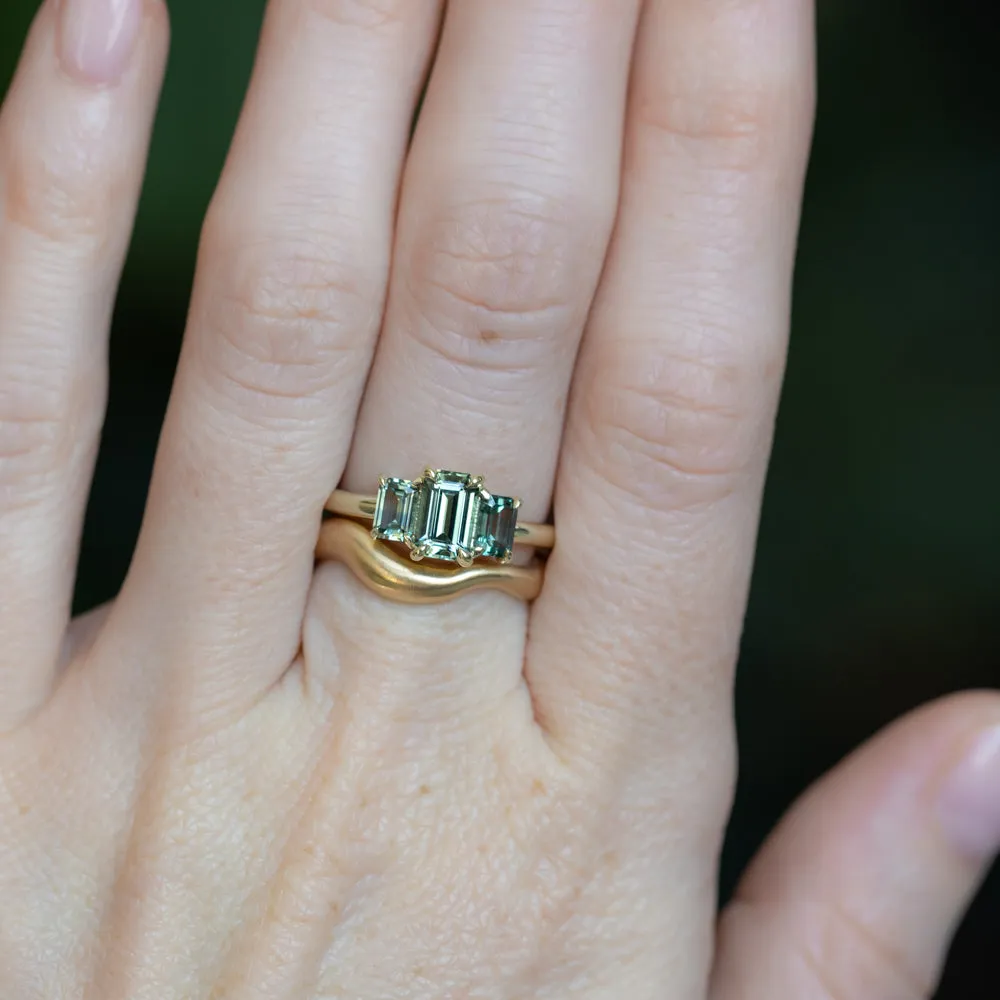 0.95ct Madagascar Emerald Cut and 0.67ctw Montana Sapphire Three Stone Low Profile Ring in 14k Green Gold