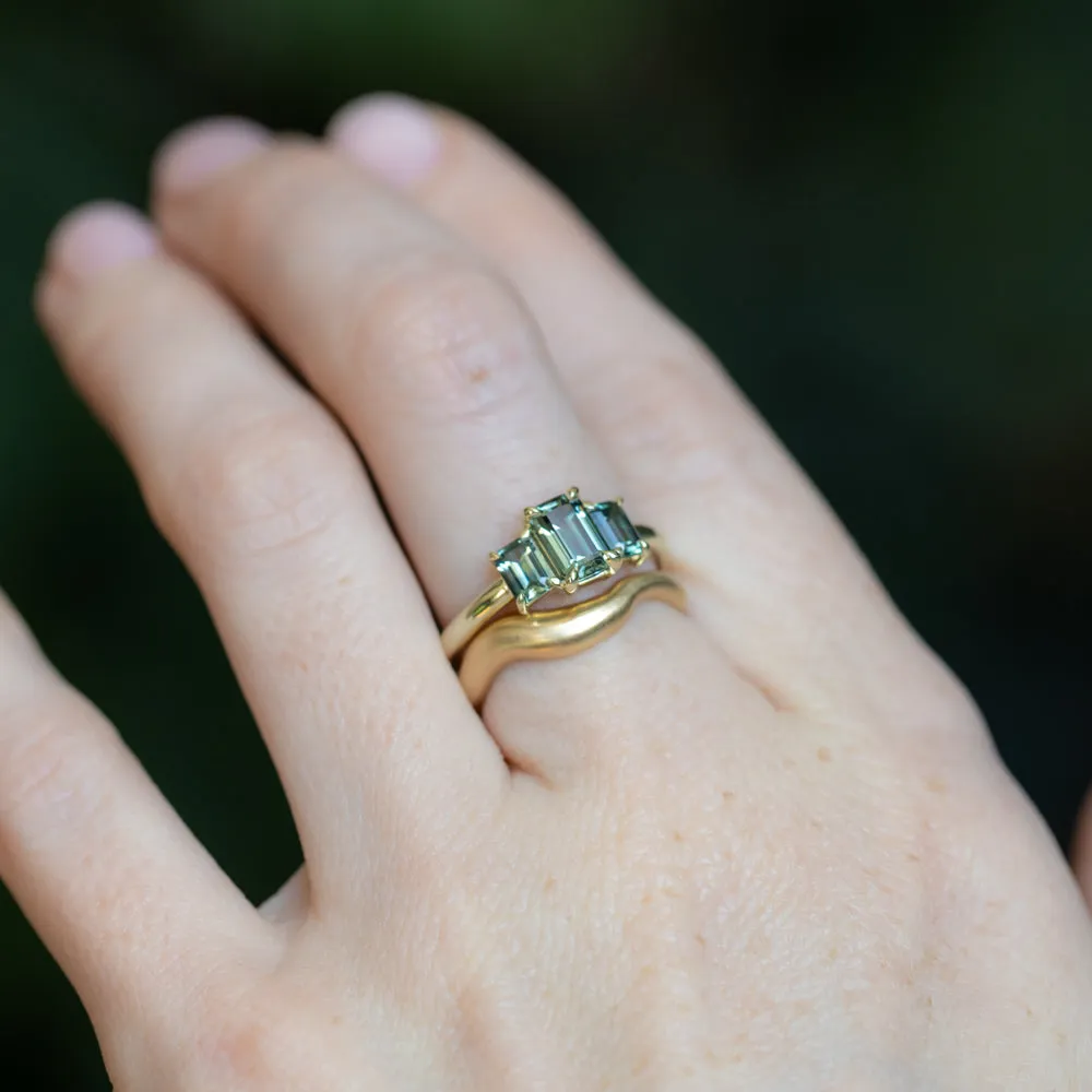 0.95ct Madagascar Emerald Cut and 0.67ctw Montana Sapphire Three Stone Low Profile Ring in 14k Green Gold