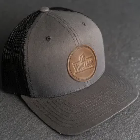 Your Logo on a Leather Patch Trucker Style Hat - Circle Patch